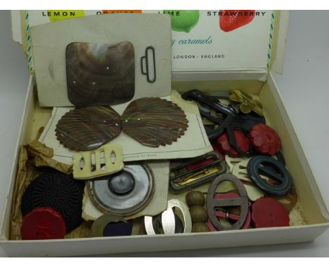 A collection of vintage buckles and buttons