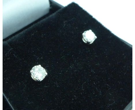 A pair of 18ct white gold and diamond stud earrings, total diamond weight 0.75ct