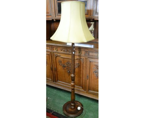 A 20th century standard lamp, turned column, dished circular base