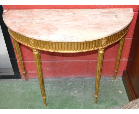 A Louis XVI Revival giltwood demi-lune console table, marble top above a frieze applied with flowerheads in a beaded border, 