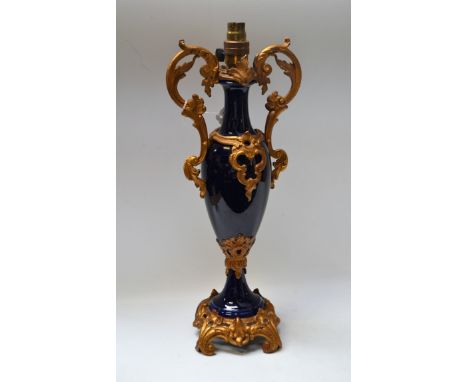 A 19th century French gilt metal mounted table lamp, heavy blue glaze, 46.5cm high