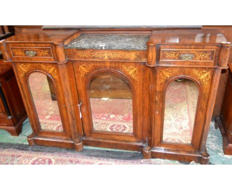 An early 20th century walnut and marquetry credenza, shaped two-tier top centred by a sunken centre inset with marble panel a