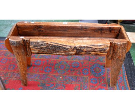 A naturalistic planter, composed of various splits of barked timber, pine lined, 103cm wide