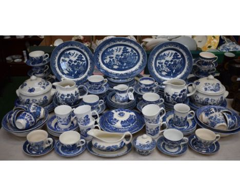 An extensive matched Willow pattern dinner, tea and table service, including dinner, side and dessert plates, bowls, cups and