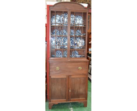 A 19th century mahogany secretaire bookcase, arched cornice above a pair of glazed doors enclosing three adjustable shelves, 