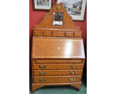 A contemporary Italian design tooled leather effect bound bureau, the shaped superstructure centred by a bevelled plate mirro