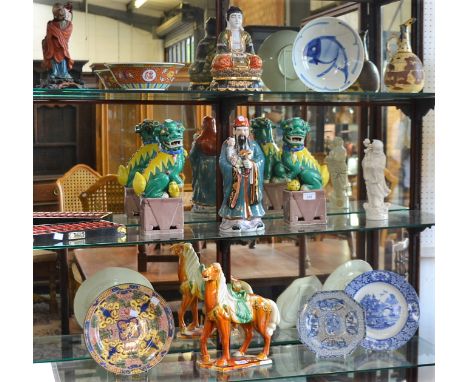Oriental and other ceramics, including a Tang style horse, a pair of Dogs of Fo; a Satsuma lamp base; a Chinese Blanc de Chin