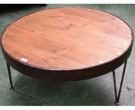 An industrial salvage style circular coffee table, cast metal frame, planked pine top, 81cm diameter