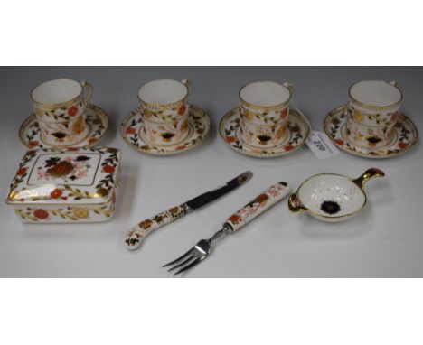 A set of four Royal Crown Derby Asian Rose pattern coffee cans and saucers, first quality; a similar rectangular lidded trink