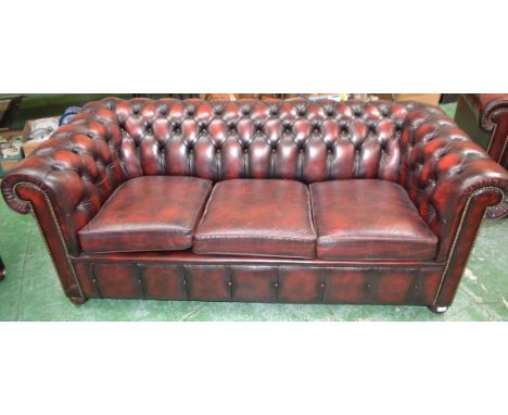 A Chesterfield type office sofa, scroll arms, deep buttoned upholstery  Condition Report: All the same colour, no rips, tears