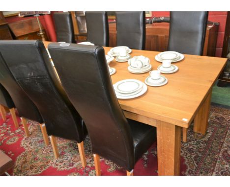 A contemporary light oak dining table, slightly rounded rectangular top, substantial square legs, 280cm long; a set of eight 