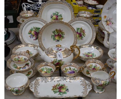 An Aynsley tea service, transfer printed with plums, grapes, raspberries, blackcurrants, etc, gilt floral rims, printed marks