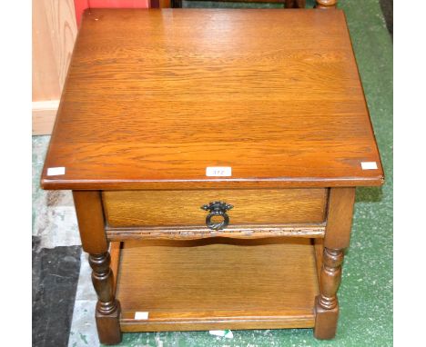 An oak lamp table, square top above a single frieze drawer, turned supports, boarded undertier, 46cm high