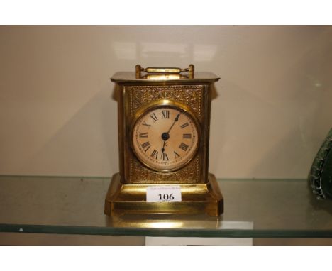 A brass cased carriage clock with spring driven movement