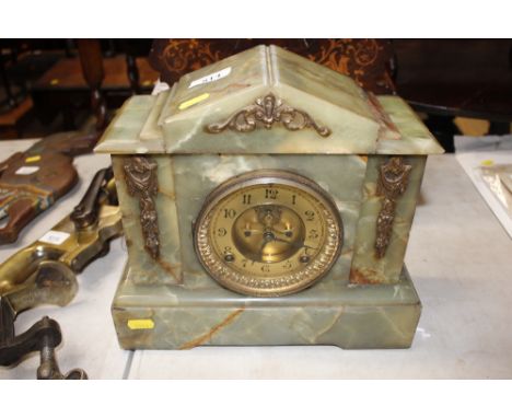 A Victorian green marble cased mantel clock with eight day striking movement - some cracks to the case 