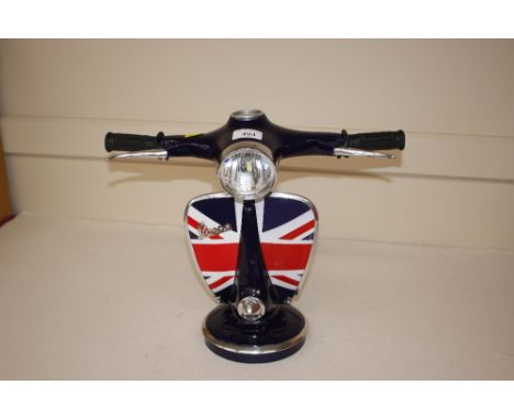 A novelty table lamp in the form of a Vespa motor scooter