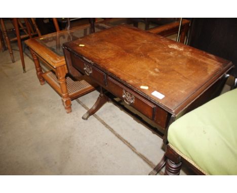 A reproduction sofa type coffee table 