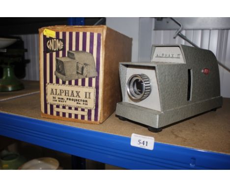An Alphax II slide projector, with original box