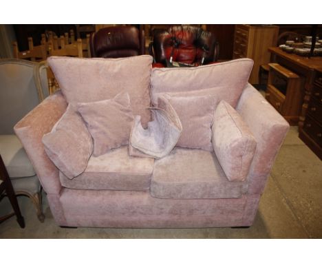 A pink upholstered Knoll sofa