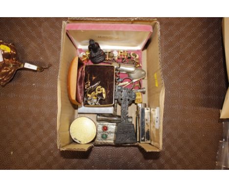 A box containing an enamel jar; lighters; cuff-links; ivory handled items etc. 