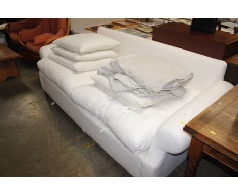 A three seater sofa with removable covers, 214cm wide x 100cm deep x 80cm high