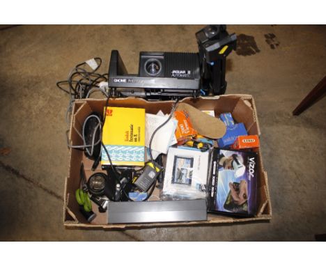 A Minolta camera; slide projector; various other photographic equipment