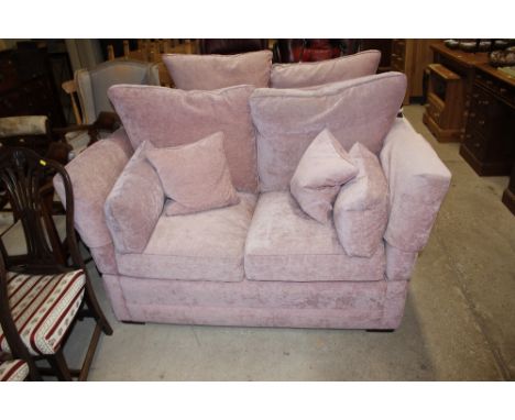 A pink upholstered Knoll sofa