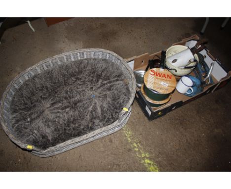 A wicker dog basket; and a box containing an enamel jug, foot pump, various accessories etc.