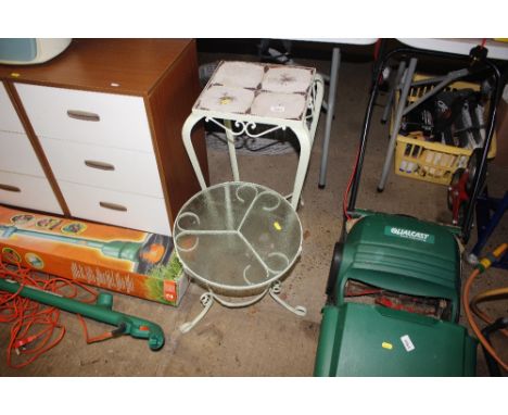A tile top wrought metal plant stand; and a wrought metal and glass similar 