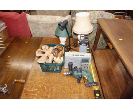 Two spirit levels; a Bosch drill; a digital radio; a lamp; two table lamp; and a quantity of shoe trees etc.