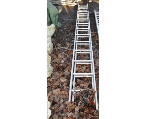 AN ALUMINIUM DOUBLE EXTENSION LADDER with thirteen rungs to each 350cm length, along with a vintage sack truck, Condition Rep