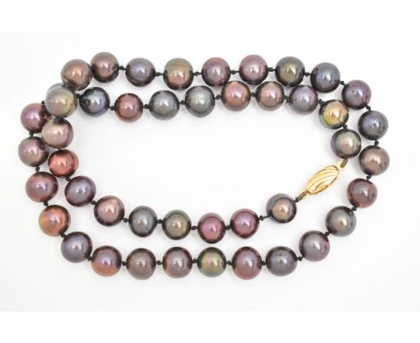 A CULTURED BAROQUE PEARL NECKLACE, single strand of peacock coloured baroque pearls, each individually knotted on a black cor