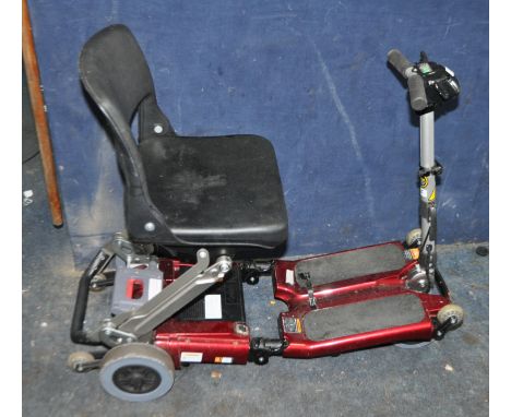 A LUGGIE FOLDING DISABILITY SCOOTER (SPARES OR REPAIRS), with charger, one battery fitted but doesn't appear to charge, batte