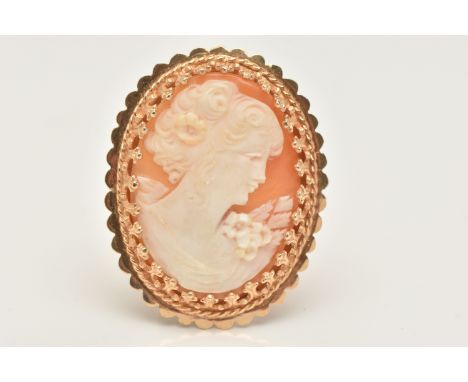 A YELLOW METAL CAMEO BROOCH, carved oval shell depicting a lady in profile, claw set to the scalloped surround, fitted with a