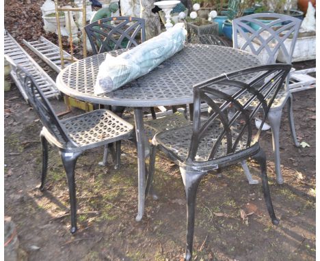 A CAST ALUMINIUM GARDEN TABLE AND FOUR MATCHING CHAIRS, table diameter 120cm, along with a parasol and base, Condition Report