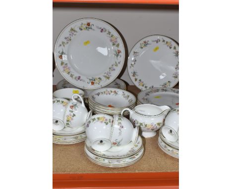 THIRTY-EIGHT PIECES OF WEDGWOOD 'MIRABELLE' TEA AND DINNER WARES to include a milk jug, a sugar bowl, a cake plate, six dinne