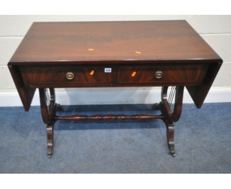 A BRIDGECRAFT MAHOGANY DROP LEAF SOFA TABLE, with two frieze drawers, raised on shaped legs, with brass castors, open width 1