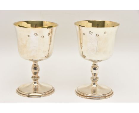 A PAIR OF ELIZABETH II SILVER GOBLETS, polished cups with knopped stems on round bases, gilt interior, each hallmarked 'Trevo