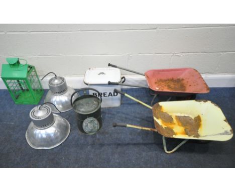 A PAIR OF INDUSTRIAL DOMED LIGHT FITTINGS, two child's wheelbarrows, a bread bin, a watering can, along with a glass and meta