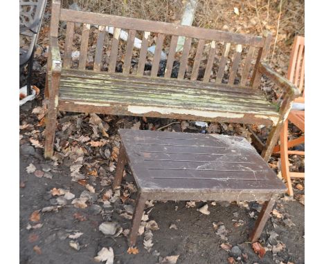 A HARDWOOD GARDEN BENCH AND OCCASIONAL TABLE bench has slatted seat and back, width 152cm,  Condition report some finish loss
