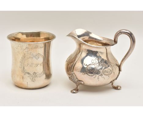 TWO WHITE METAL ITEMS, to include a cream jug with engraved floral pattern, raised on three leaf detailed feet and scroll han