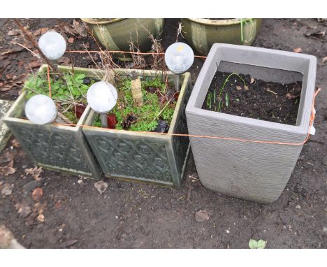 THREE MODERN PLASTIC GARDEN PLANTERS including a pair of square pots with ecclesiastical detail to each facet, 32cm across an