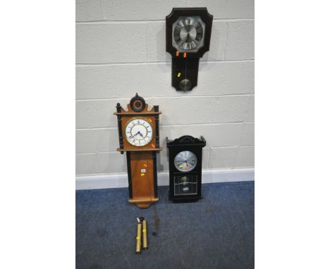 THREE LATE 20TH CENTURY WALL CLOCKS, varying in shape, size style, timbers, etc, condition report: largest clock with two bro