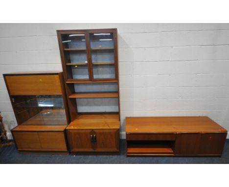 THREE PIECES OF MID CENTURY TEAK FURNITURE, to include a wall cabinet, with double glass doors, atop a base with double cupbo