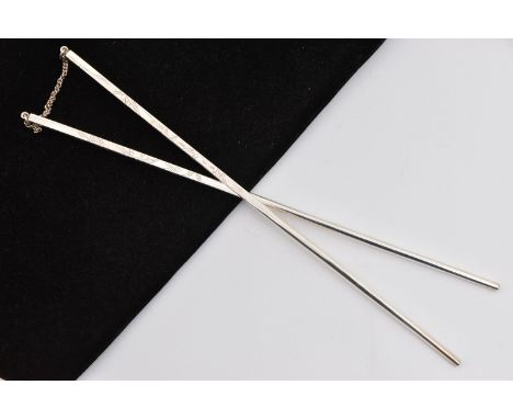 A PAIR OF WHITE METAL CHOP STICKS, tapered chopsticks, etched with textured detail, chain linked together, approximate length
