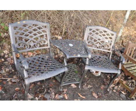 A METAL DOUBLE GARDEN SEAT with central shelf, hammered finish and lattice seat and backs, width 161cm. Condition Report: no 