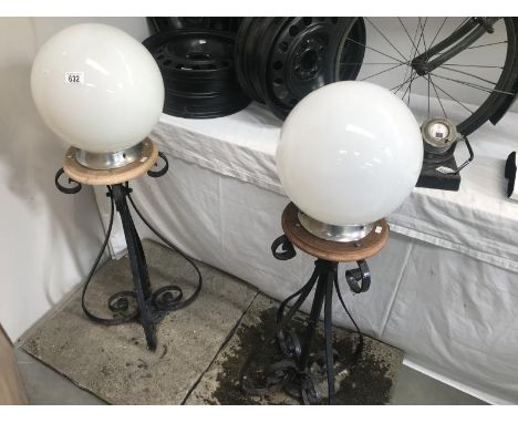 A pair of post gate lamps.