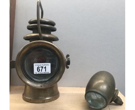 An early 20s brass Howes and Burley ltd Birmingham veteran car side light and 1 other.