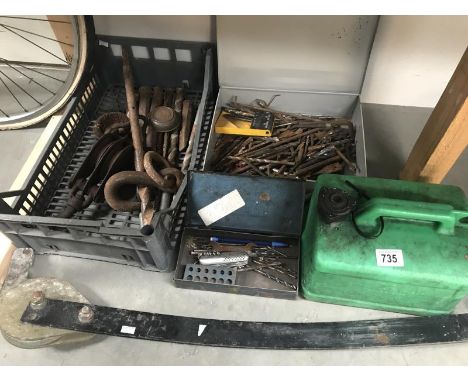 A box of drill bits. tray of tools including block, caravan stabiliser and petrol can.
