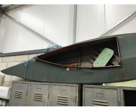 A vintage 1950s canvas canoe A/F.
